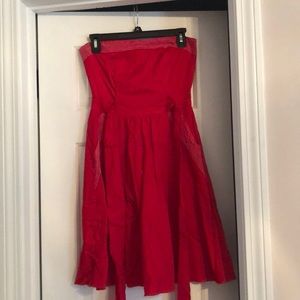 Red strapless dress with tie at waist